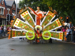 Red Indian head dress costume, Leeds Carnival 2015. Photo by Mick Burton continuous line artist.