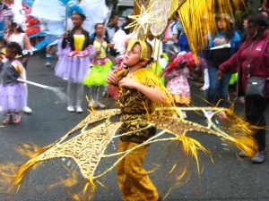 Gold costume at the Leeds Carnival. Photo by Mick Burton, continuous line artist.