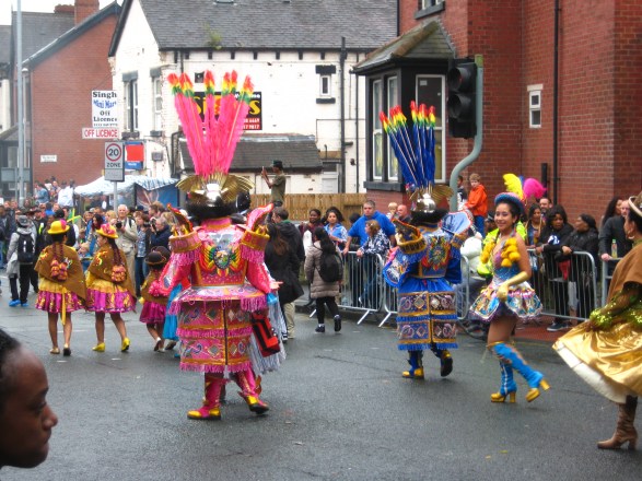 Bolivian costumes, back view, at the Leeds Carnival. Photo Mick Burton, continuous line artist.
