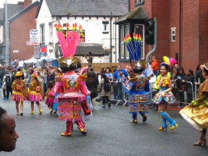 Bolivian costumes, back view, at the Leeds Carnival. Photo Mick Burton, continuous line artist.