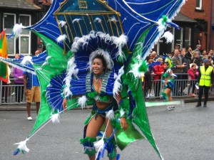 Blue and Green costume at Leeds Carnival. Photo Mick Burton, continuous line artist.