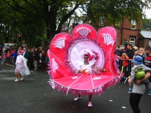 Pink costume at Leeds Carnival. Photo Mick Burton, continuous line artist.