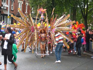 Multi petal costume at Leeds Carnival parade. Photo Mick Burton, continuous line artist.